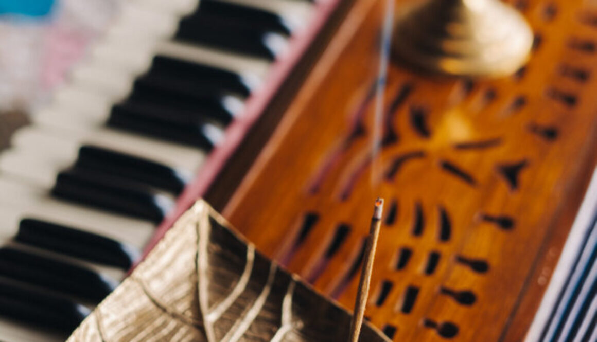 harmonium during the practice of kundalini yoga and the incense standing on it